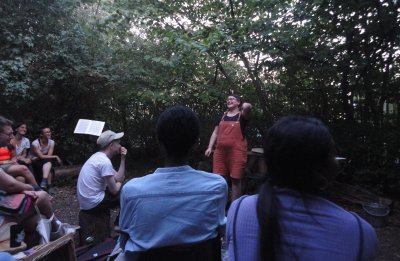 dusk in the nature reserve, Linden Mcmahon is presenting to a smiling audience
